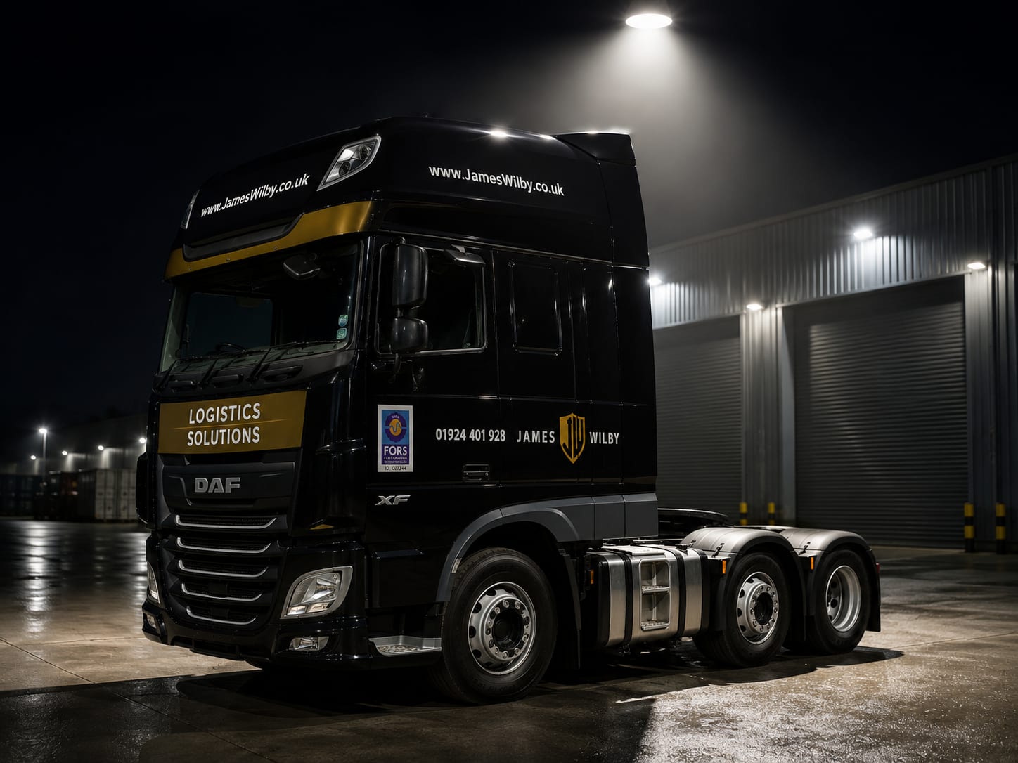 James Wilby branded HGV parked outside the depot at night