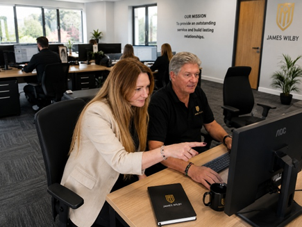 James Wilby recruitment colleagues reviewing candidate information in the office